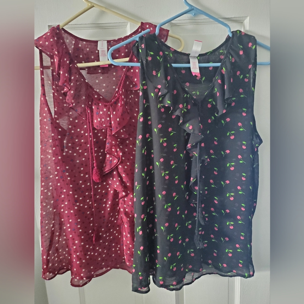 Two No Boundaries Black Cherry Ruffle Blouse And Blue And White Star Blouse.